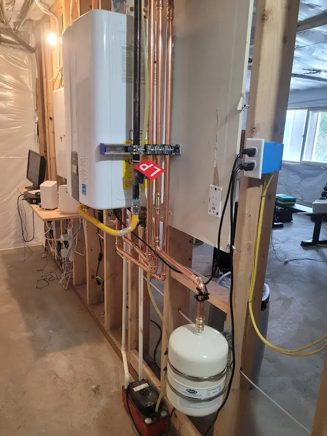 Licensed plumber repairing a kitchen sink in Marshfield